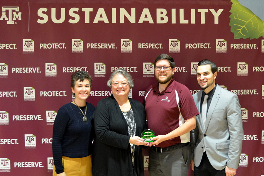Dr. Carol Binzer and Brandon Carlson accept the Overall Top Performer Award for Residence Life.