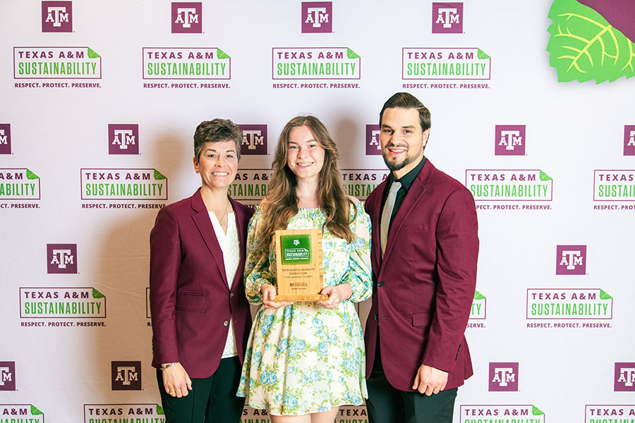 MK Futrell accepting the Sustainability Champion Undergraduate Award with Kelly Wellman and Ben Kalscheur