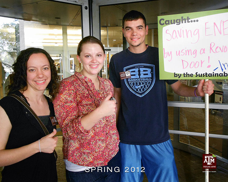 Spring 2020 Student Interns Bobbie, Miranda, and Nick pose with the Sustainability Cam whiteboard.