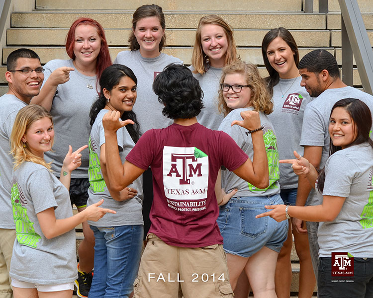 Student interns gathered to show off their team shirt.