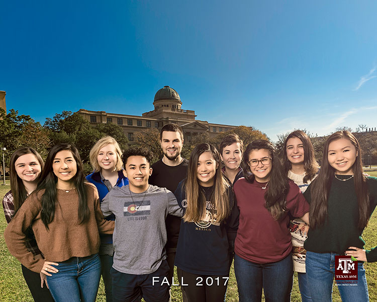 The Fall 2017 Interns pose in front of the Academic Building for the end of the semester photograph.