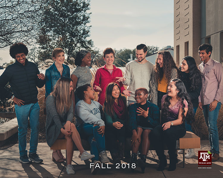 The Fall 2018 Interns laugh as they gather for the end of the semester photograph.