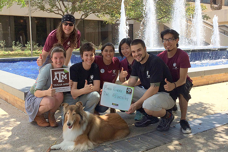 The student interns and staff pose with Reveille at an Earth Day Event in 2014.